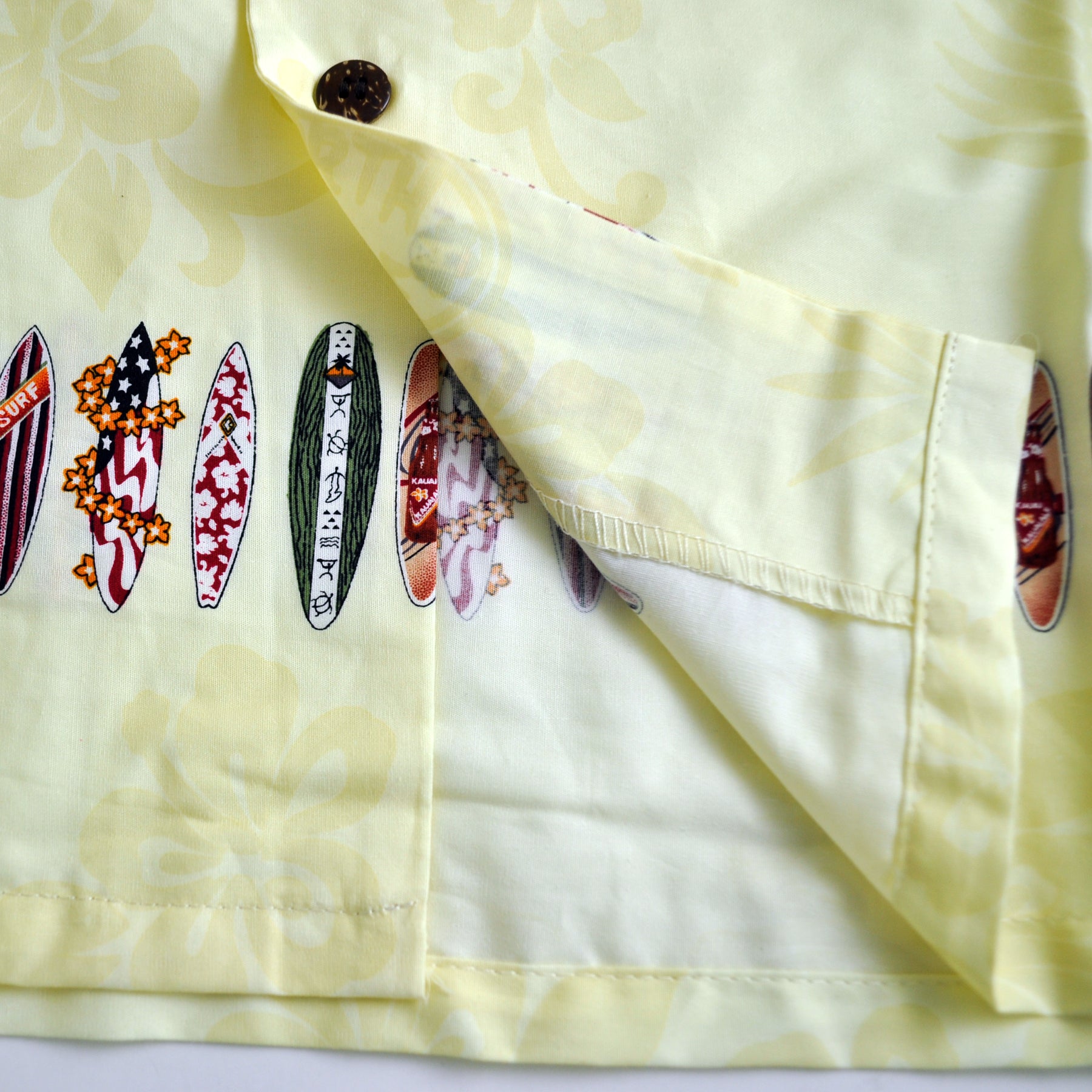 High Surf Men's Hawaiian Shirt depicting Palm Trees, Cars and Surfboards in Yellow. Close up of Fabric