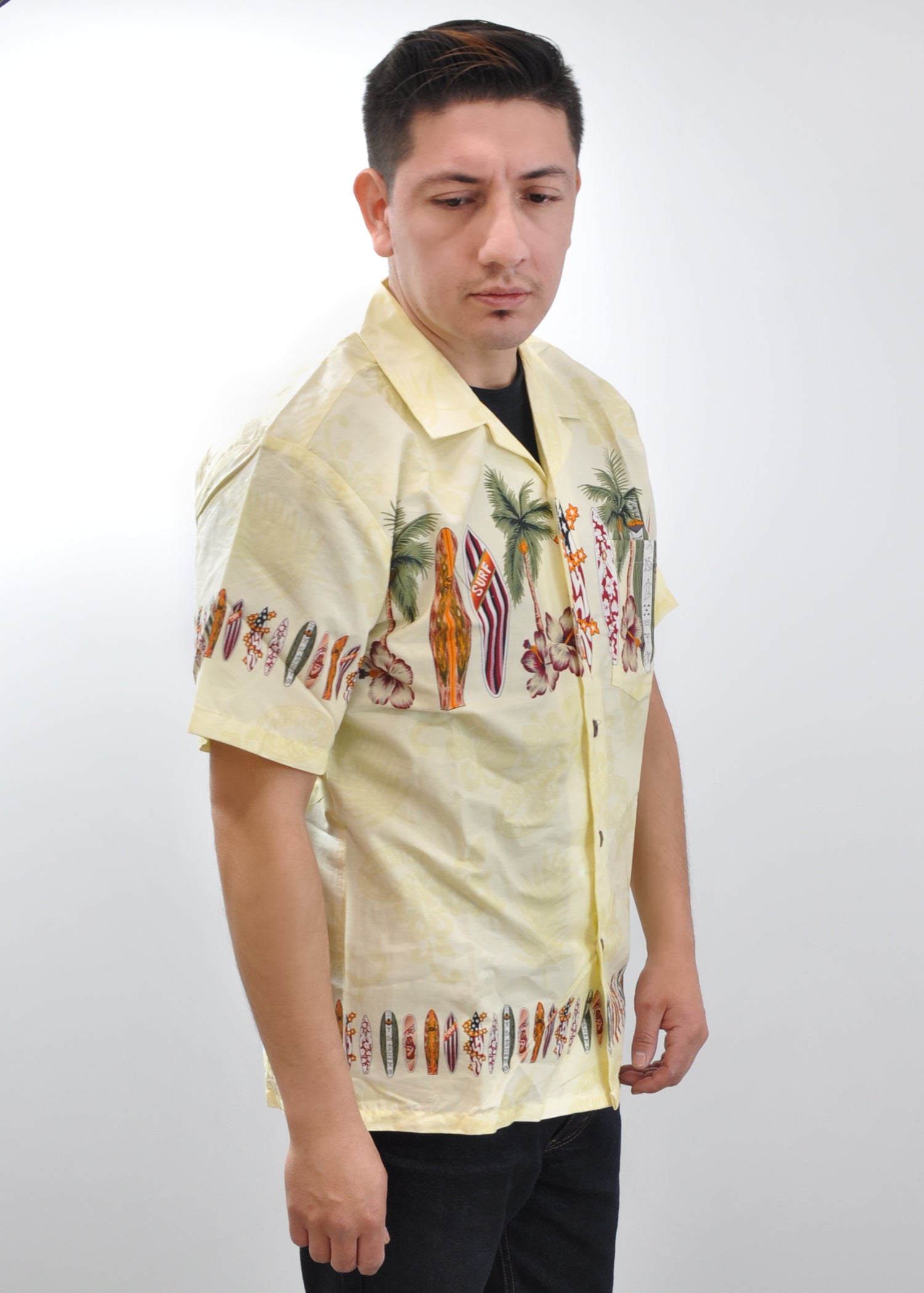 Model wearing High Surf Men's Hawaiian Shirt depicting Palm Trees, Cars and Surfboards in Yellow. Front View.