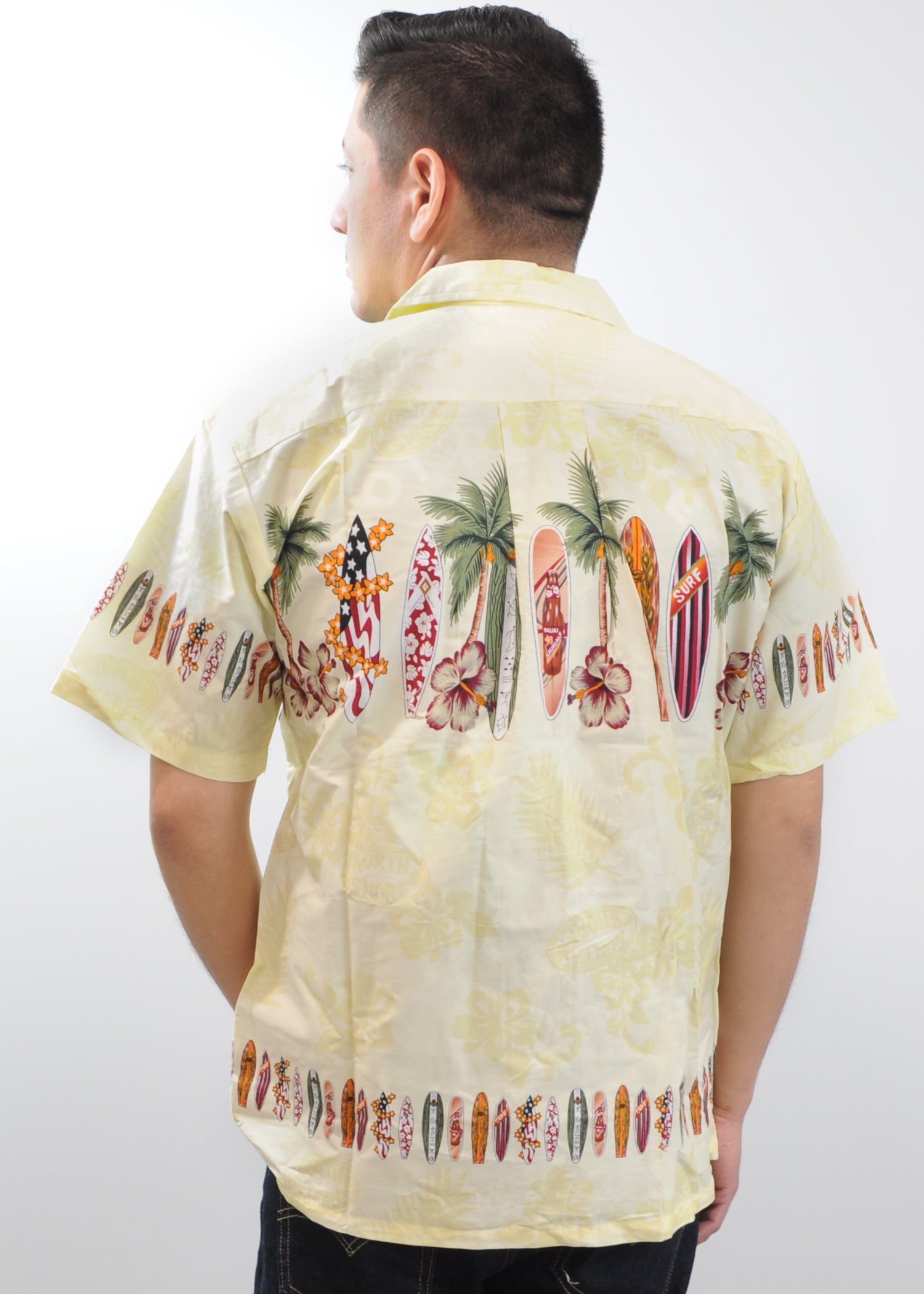 Model wearing High Surf Men's Hawaiian Shirt depicting Palm Trees, Cars and Surfboards in Yellow. Back View.